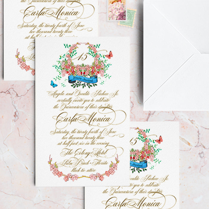 Wedding invitation with floral design and gold text on a marble surface