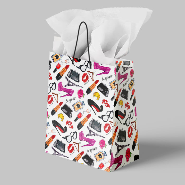 Tissue paper in a decorative bag with fashion-themed designs on a gray background paper giftbag penitentprint i love paris french lover parisian