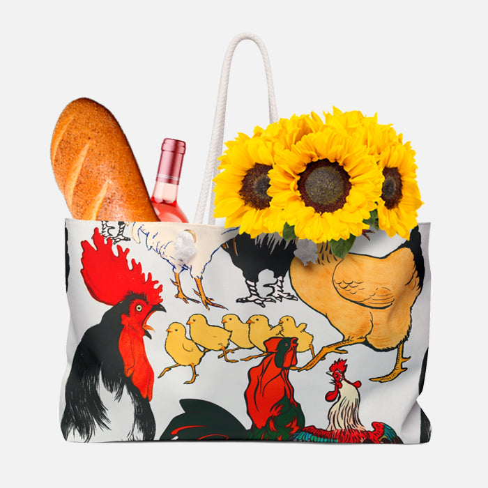 Tote bag with chicken design holding bread, wine, and sunflowers on a white background