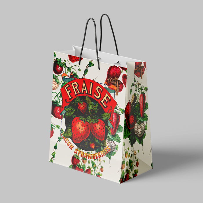 Gift bag with strawberry design and 'Fraise' branding on a gray background