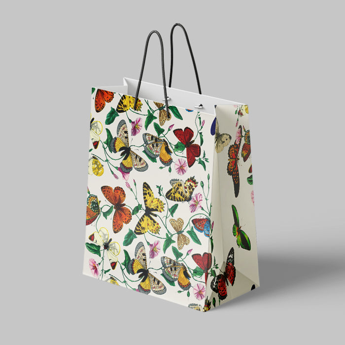 Gift bag with butterfly design on a gray background