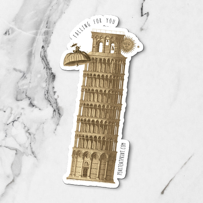 Fridge Magnet of the Leaning Tower of Pisa on a marble surface