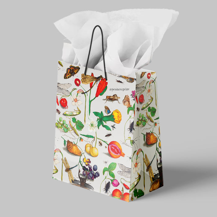 Gift bag with nature-themed design on a gray background