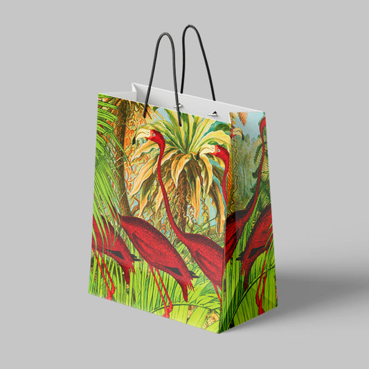 Paper Gift Bag with red bird and green leaf design on a gray background