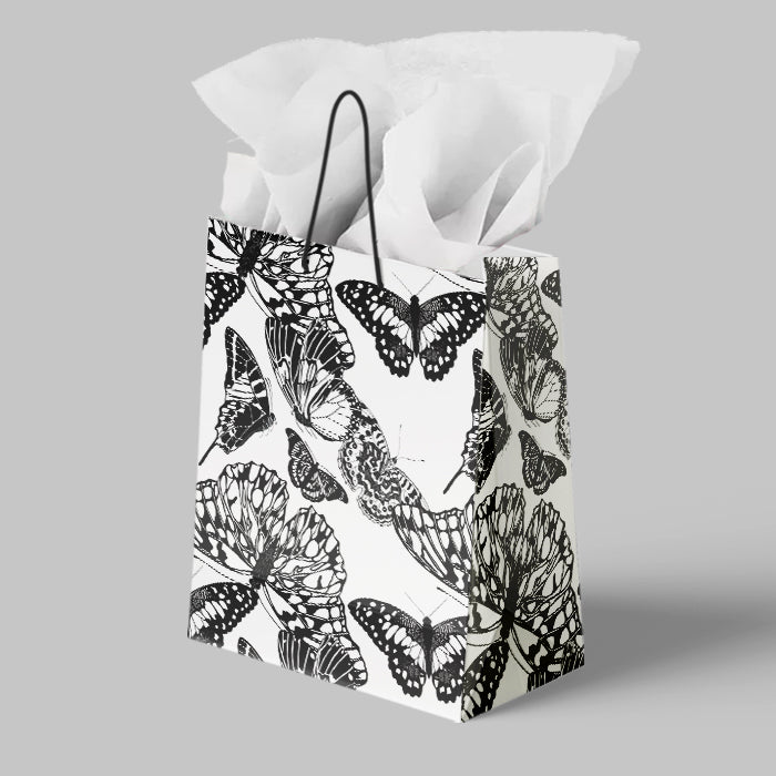 Gift bag with butterfly pattern on a gray background