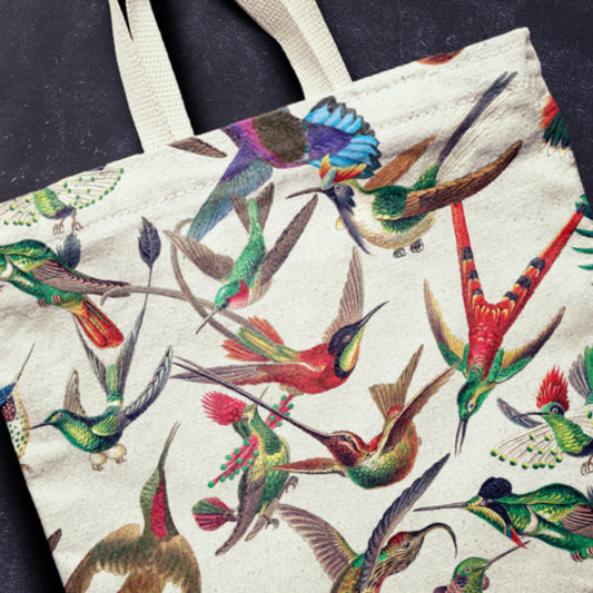 Tote bag with colorful hummingbird pattern on a dark background