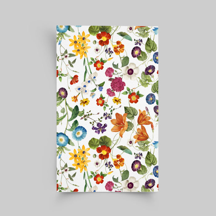 Notebook with colorful floral pattern on a gray background